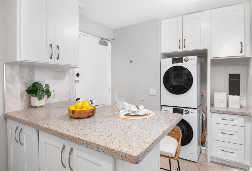 Stacked Washer + Dryer with built in cabinets