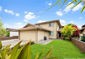 Exterior view of home with enhanced view of front yard.