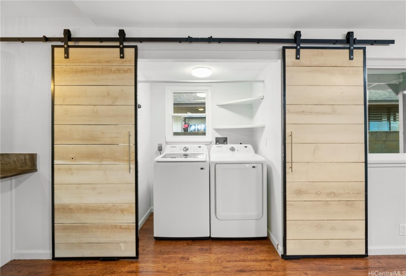 Laundry room with barn door entry.