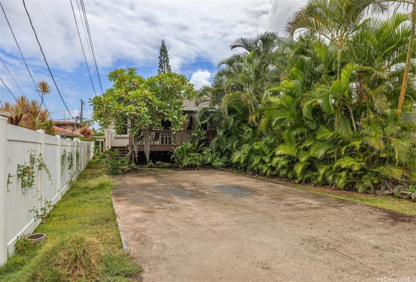 Home comes with a spacious parking pad for 4 vehicles.