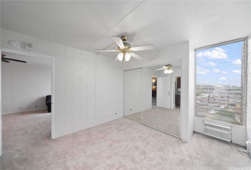 Primary Bedroom facing doorway.  Enjoy the mountain view and natural light captured through the window.