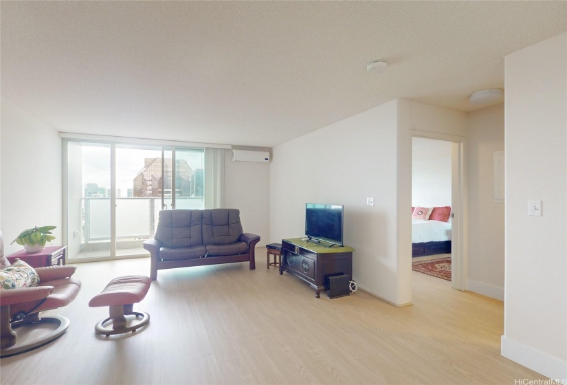 Spacious living room with new vertical blinds.