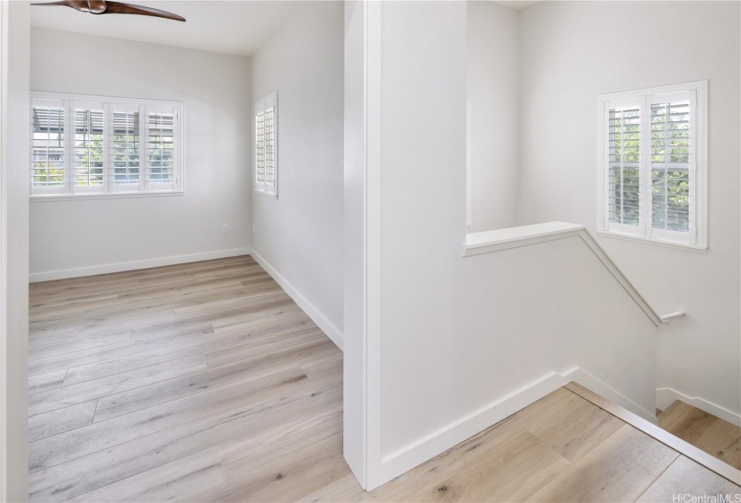 Den with new fan, flooring and plantation shutters