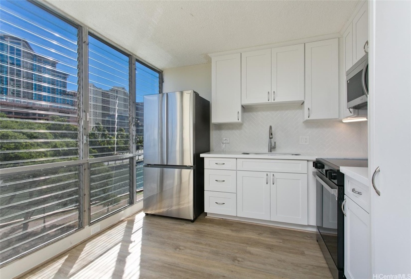 Living Room view towards Kitchen and Ewa/Ala Wai Canal