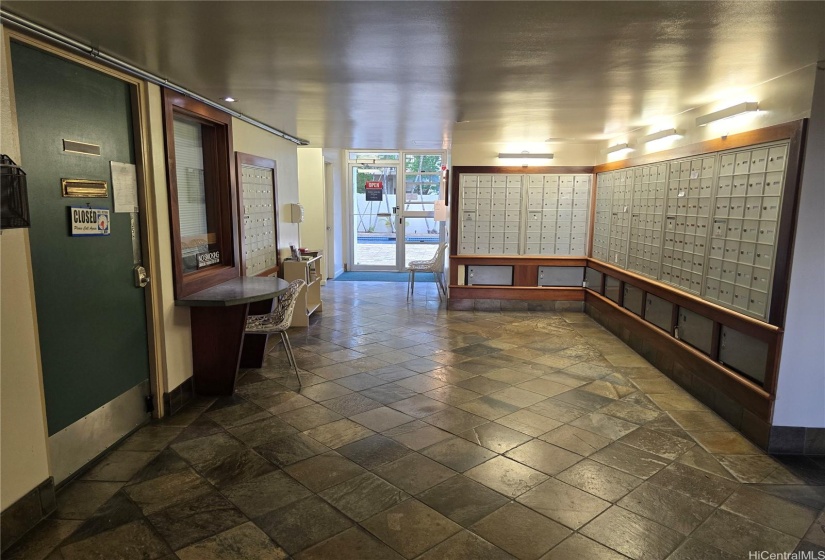 Mailboxes in the main lobby right outside of the office. Swimming pool straight ahead with fob access.