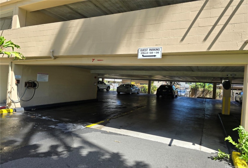 Car wash station on the left and another parking garage (one-level) that offers Guest Parking. Street parking available on a first-come, first-served basis.