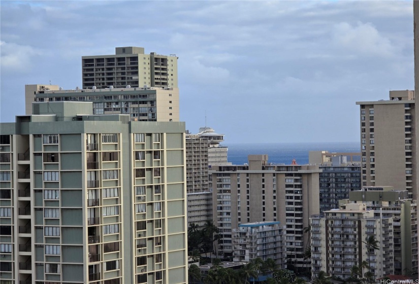 Peek of the ocean from your balcony outside of the living room on the main level.