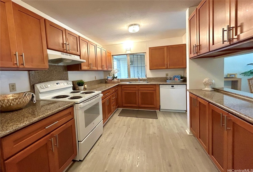 Warm wood cabinetry w/ ample space