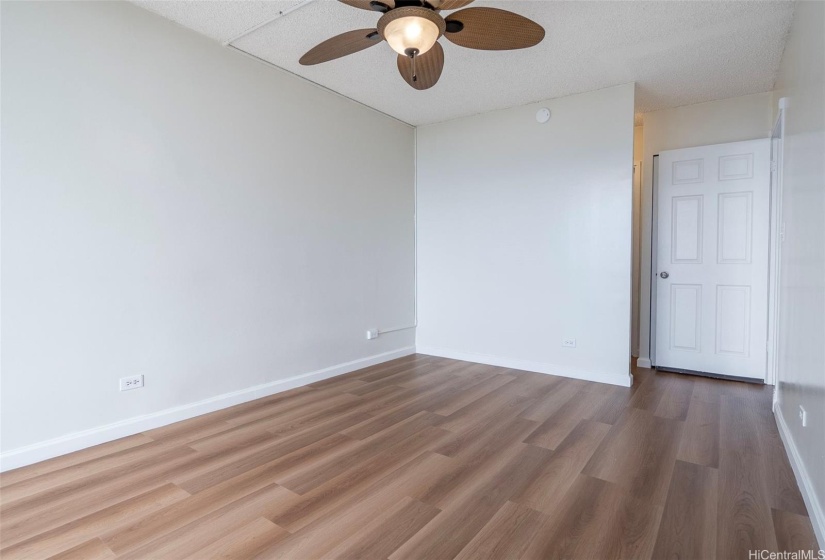 Primary bedroom with brand new LVT plank flooring.