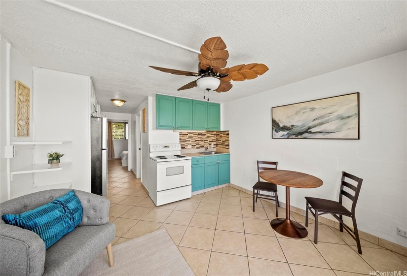 The dining room and living room have been freshly painted, with an open-concept kitchen, living room, and dining area, plus a new ceiling fan!