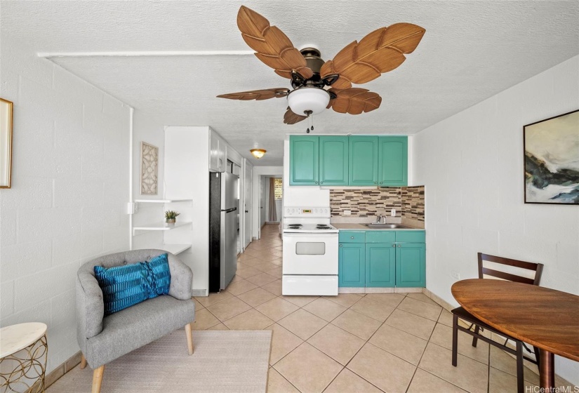 The dining room and living room have been freshly painted, with an open-concept kitchen, living room, and dining area, plus a new ceiling fan!