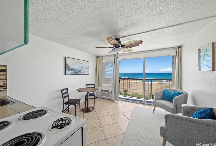 The dining room and living room have been freshly painted and updated with a new ceiling fan. Enjoy ocean views from the living room.