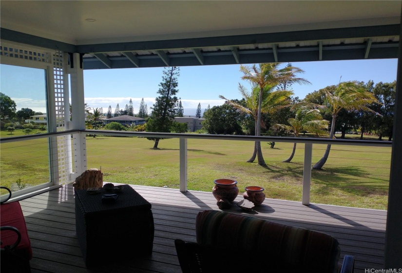 Back patio looking out over the golf course with an open sliding glass door.