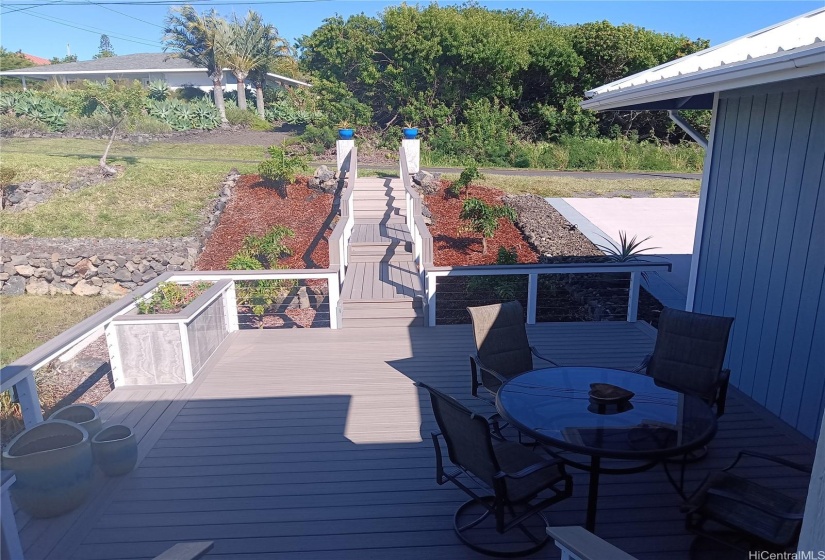 Elevated walkway and stairs leading to the front patio.