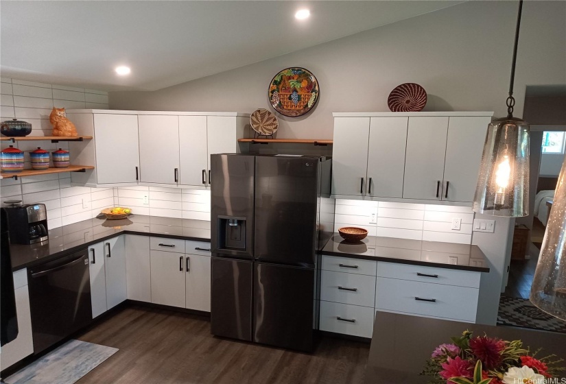 Kitchen close up, right side with refrigerator.