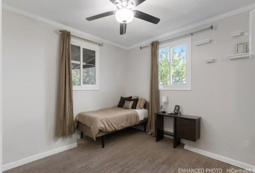 enhanced photo with virtual staging of a secondary bedroom