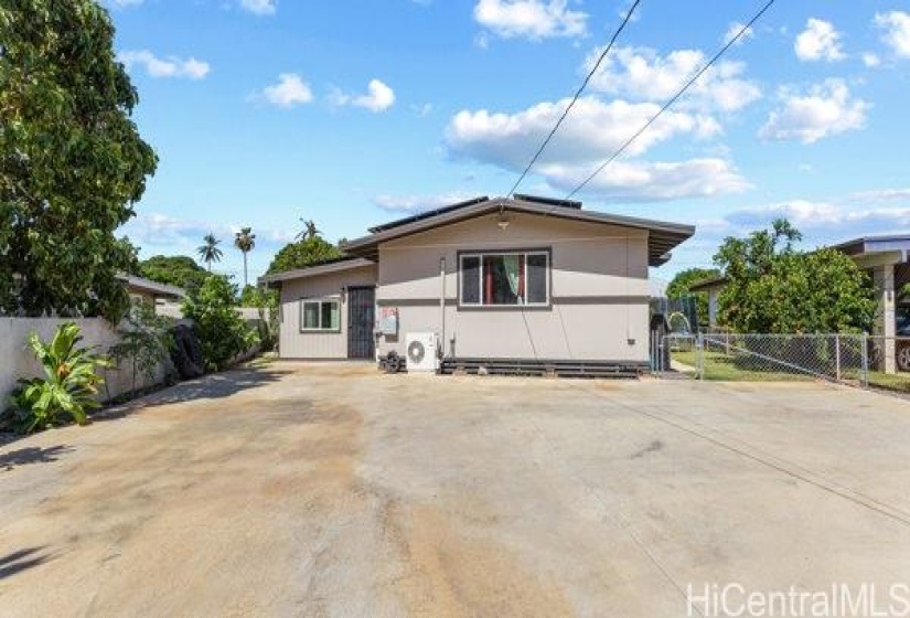 front of the house - huge cemented are to park up to 6 cars or even a boat.