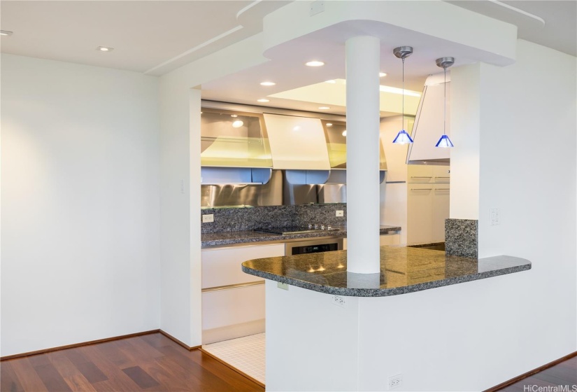 Renovated kitchen with countertop bar.