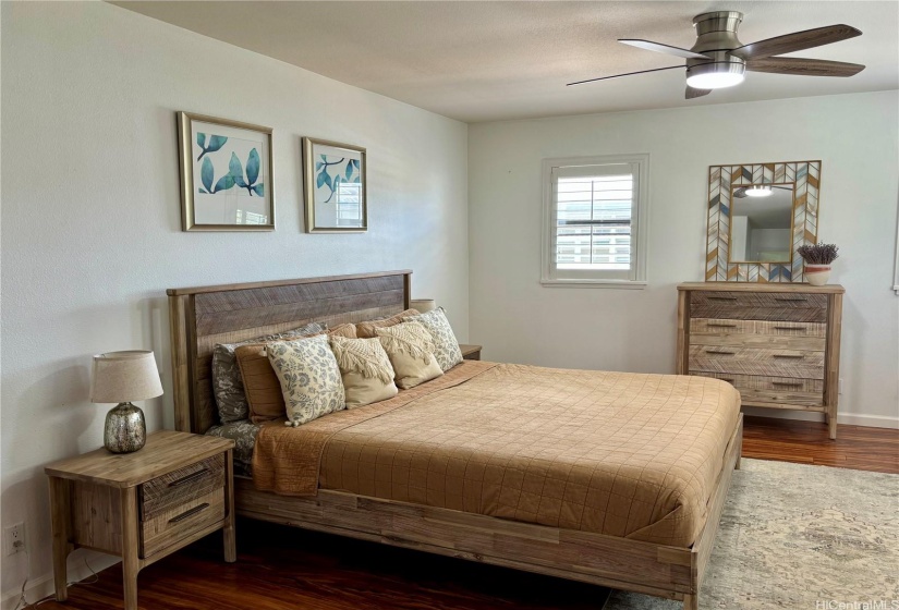 Bedroom #2. Primary bedroom with french doors and in suite bathroom.