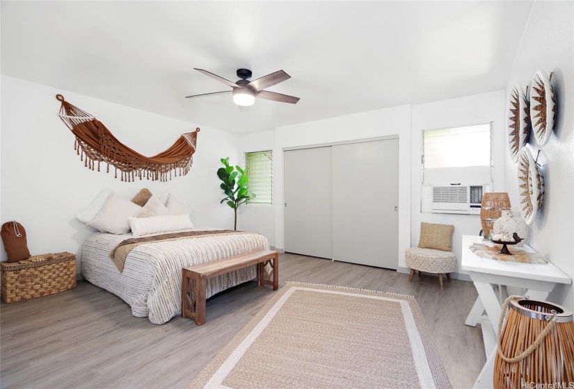 Upstairs spacious primary bedroom, new Window AC and ceiling fan.