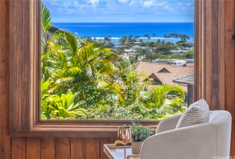 Ocean view accented by tropical greens framed by cedar