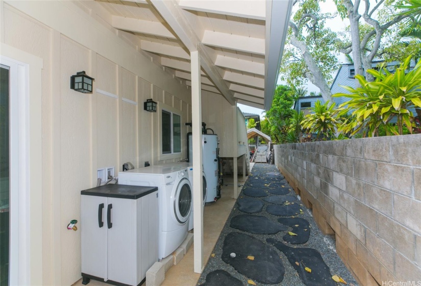 Back of house - washer, dryer, water heater and fire sprinkler piping