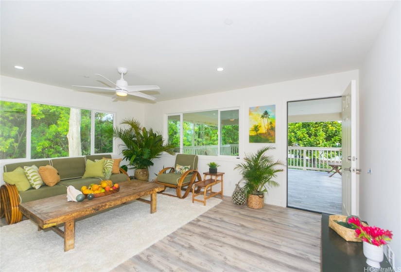 Staged - Upstairs living room looking out to open Lanai Best feature of The Home