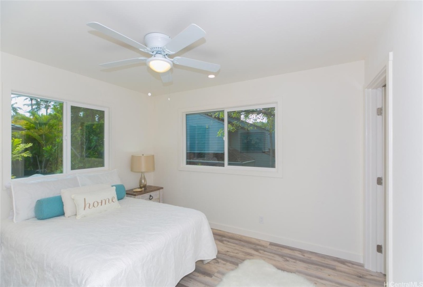 Up Stairs Primary bedroom with walk-in closet with washer and dryer  and full bath with walk in shower.