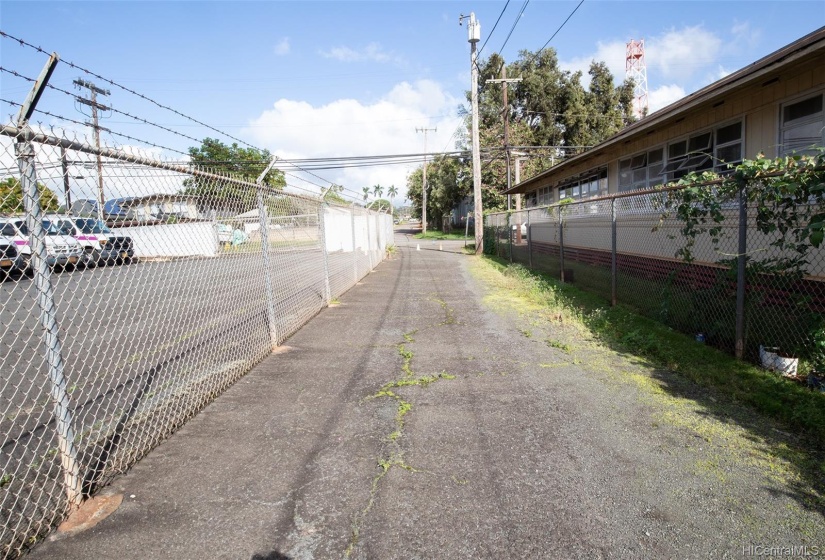 Driveway looking back to Koa St.  It is a one lane roadway that exists on maps from 1942 when the California Packing Corp had their employee's camp there.  This is what the owner used for his vehicle access to his property.