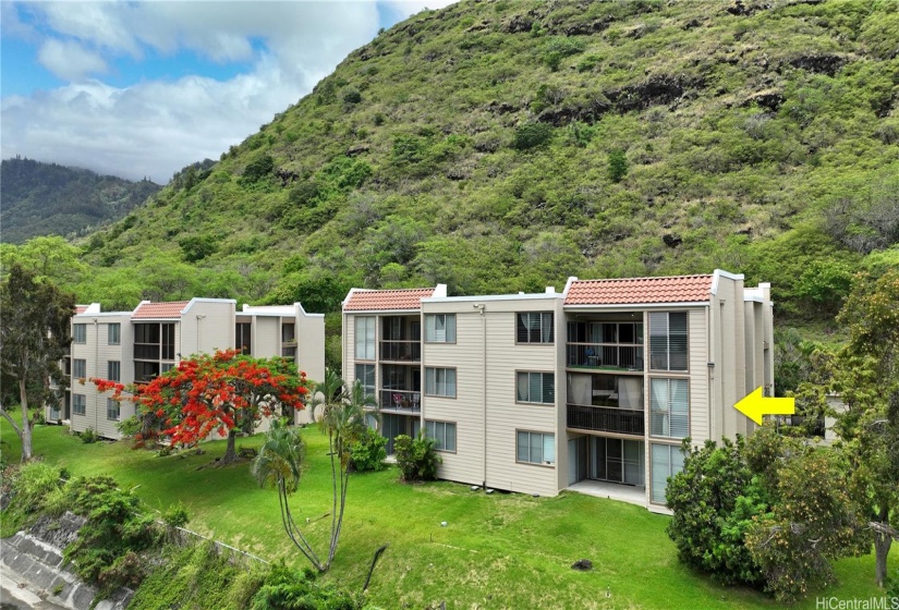 Back side of building. Unit is located at the corner/end on the second floor of these three-story townhomes nestled in the back of Kuliouou. Recently repainted and roofs, siding, and railing/spalling recently replaced..