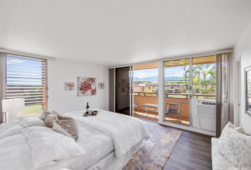 Primary bedroom with lanai and window AC