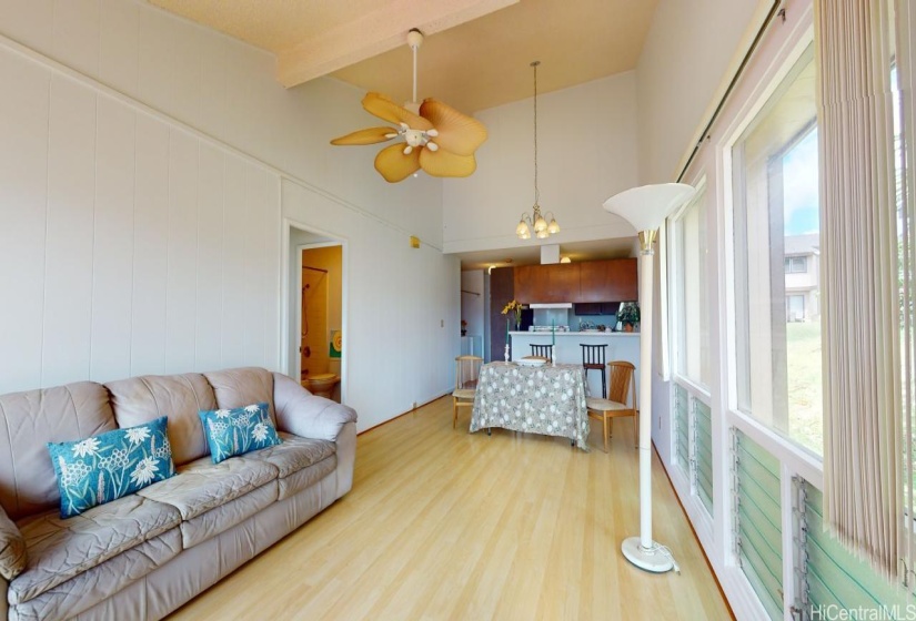 View from front door.  Living room/dining area with vaulted ceilings.