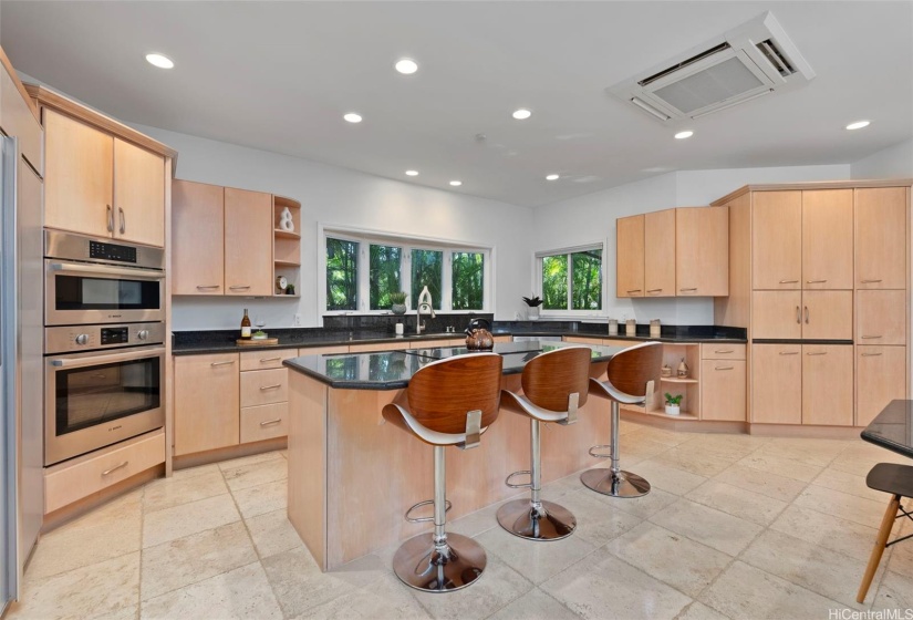 Open-concept kitchen with granite counters, solid-wood maple cabinets, Bosch appliances