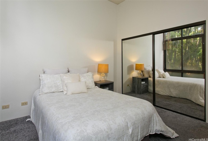 Master Bedroom with full length mirrored closet doors