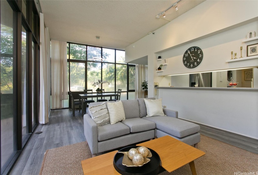 Spacious open concept living space to dining room with a view of the kitchen