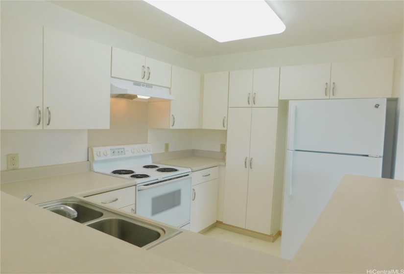 Kitchen includes range, range hood, disposal, refrigerator, dishwasher,