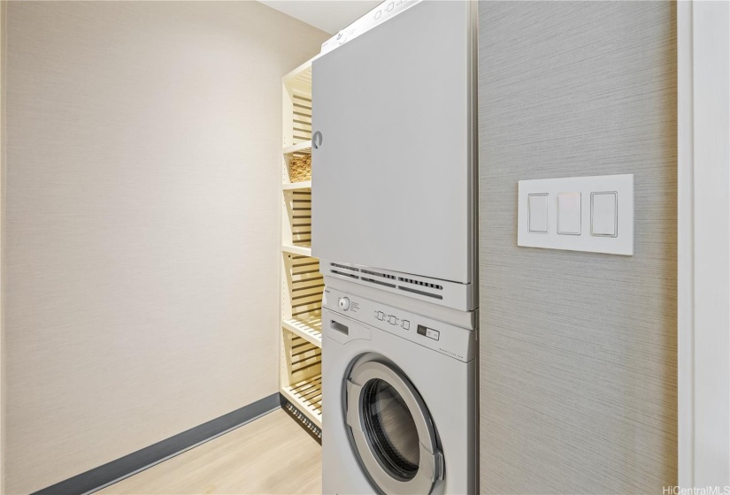 Laundry room with large vented attic upstairs