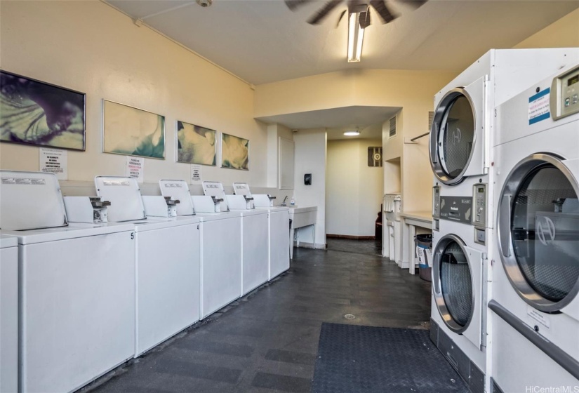 Common area laundry room with washer and dryer