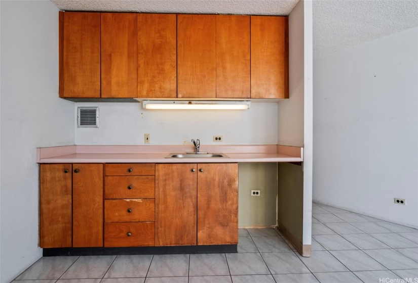 Kitchen area with overhead countertop light