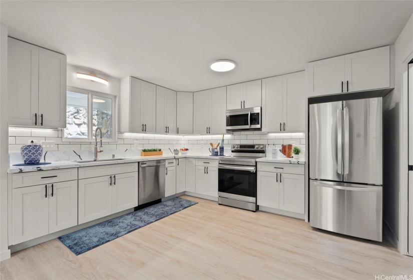 Rear residence - kitchen w completely new stainless steel appliances.