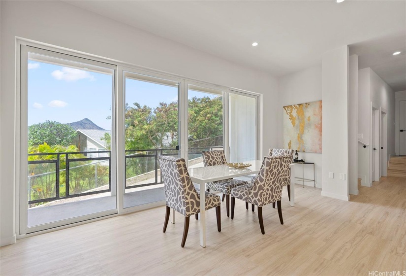 Front residence - spacious dining area with an abundance of natural light and access to lanai.