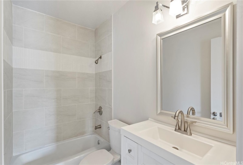 ENHANCED - Full Bathroom #3, upstairs, New vanity, sink, hardware, light, floor tile, and tiled tub-surround.