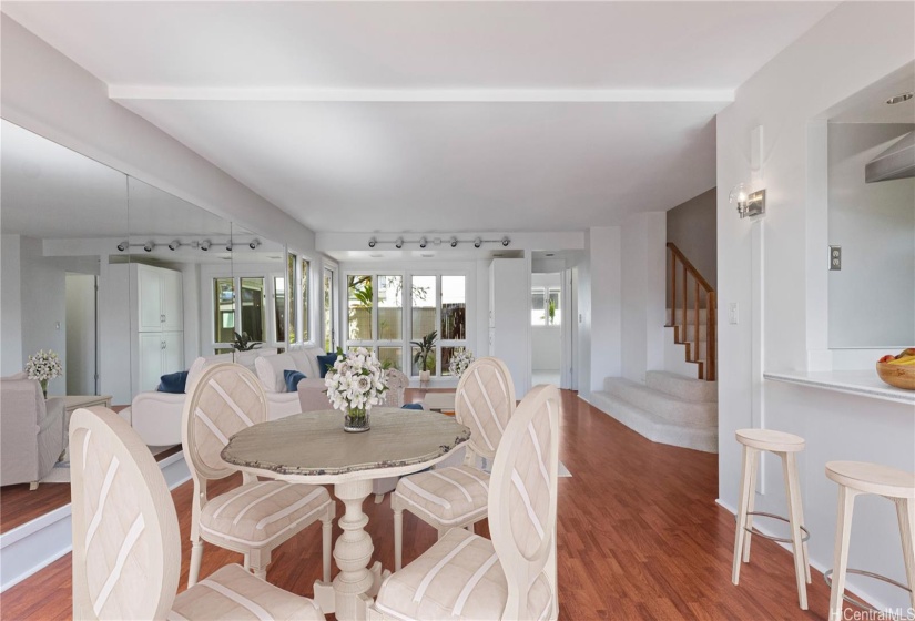 ENHANCED - Dining area adjacent to kitchen pass through. Many windows for a bright, cheerful space.