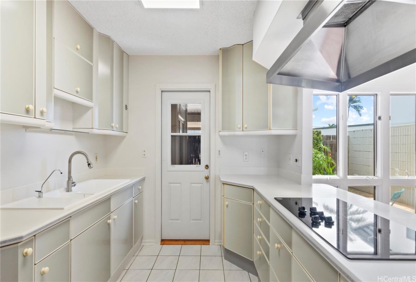 ENHANCED - New faucet, Reverse Osmosis water filter, lots of counters. Wonderful chef's kitchen! New door to laundry/storage, carport area.