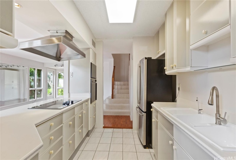 ENHANCED - View from back entry door across kitchen.