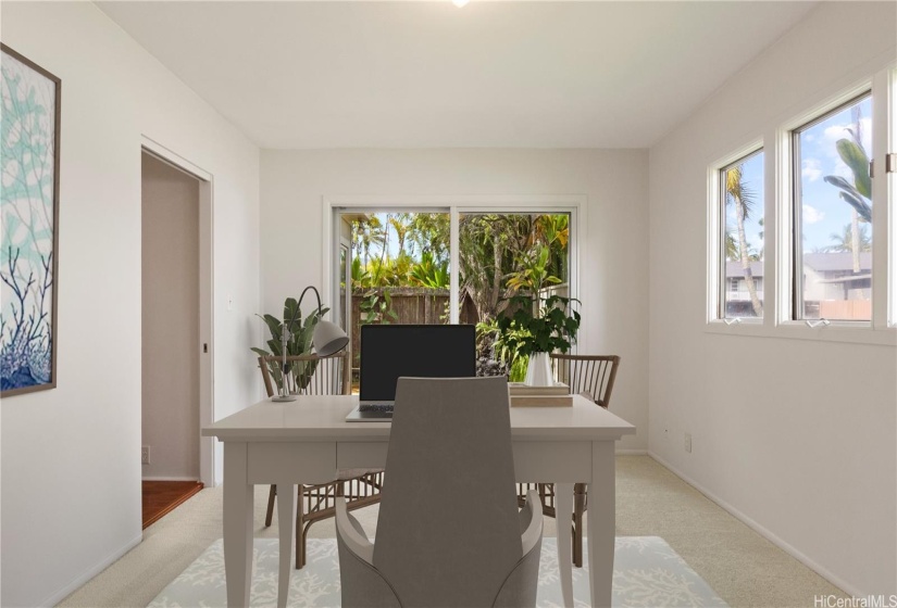 ENHANCED -  Downstairs Bedroom 1, with sliding glass door to charming lanai and adjacent full Bathroom.