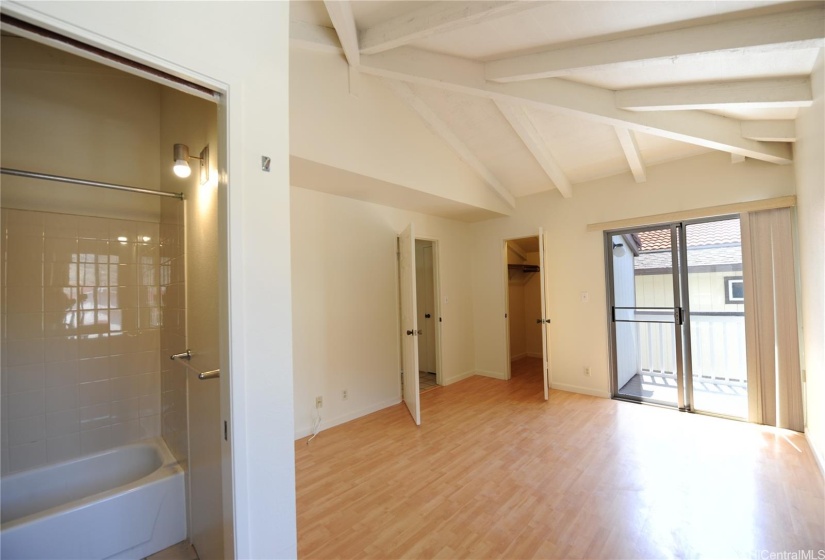 Primary Bedroom with Walk In Closet and Balcony