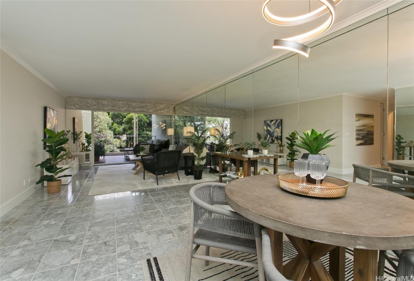 Contemporary lighting throughout adds to the mirrors, marble and crown molding.