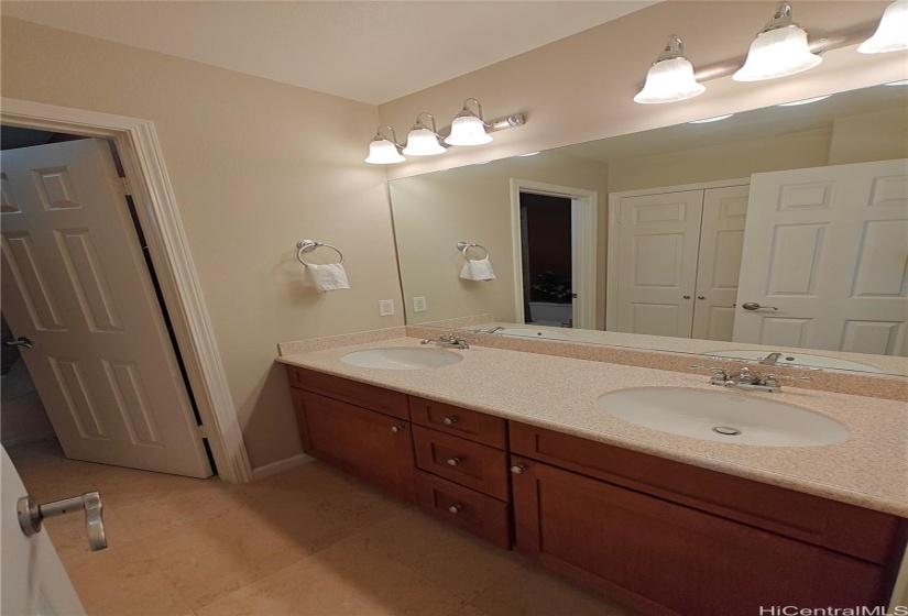 Shared bathroom with a door to the toilet and shower.