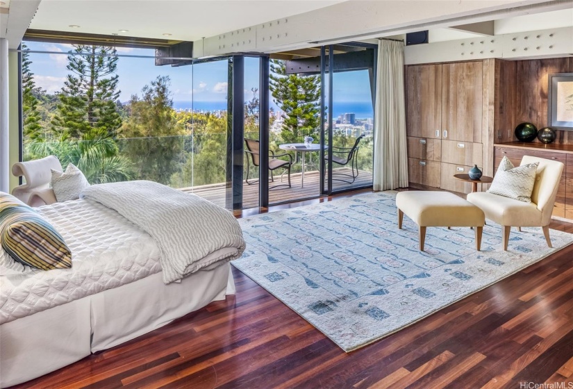 Another spacious bedroom suite facing the ocean includes a private lanai